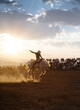 © Matthew Spaulding/Stocksy - Cowboy riding wild horse at rodeo