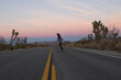 © Weird Pixel/Stocksy - Woman Longboarding at Sunset