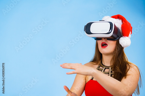 Girl watching 3d film tour in virtual reality glasses.