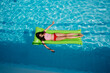 © Beatrix Boros/Stocksy - Pre-teenager girl relaxing on an inflatable air mattress