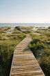 © Raymond Forbes LLC/Stocksy - Boardwalk to Beach on Fall Afternoon