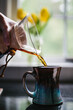 © Matthew Spaulding/Stocksy - Pouring fresh home brewed coffee into mug
