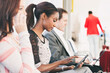 © Sean Locke Photography/Stocksy - Airport: Pretty Woman Using Digital Tablet While Sitting In Airport