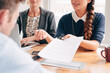 © Aila Images/Stocksy - Close up businesswoman hands pointing to legal document for signing