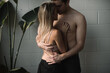 © Jess Craven/Stocksy - Young couple in an intimate embrace