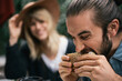 © Emmanuel Hidalgo/Stocksy - Man taking bite of delicious sandwich
