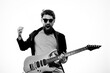 © SHOTPRIME STUDIO - man with guitar in hands musician rock star performance lifestyle light background