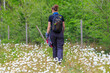 © Beautyness - Single woman is hiking trough white blossoms, Thuringia, Germany
