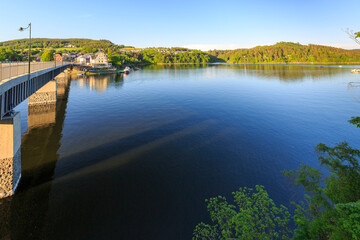 Naklejka na meble A perfect warm orange sunset is kissing the surroundings of Saalburg, the boats are tied at the Lakeshore, Thuringia, Germany