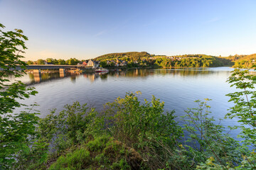 Naklejka na meble A perfect warm orange sunset is kissing the surroundings of Saalburg, the boats are tied at the Lakeshore, Thuringia, Germany