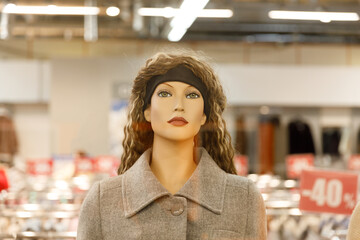 Poster - beautiful female mannequin in a clothing store