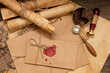 © Andrey - The old letter is sealed with sealing wax and a seal in an envelope. Scrolls with a wax seal.