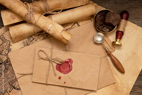 The old letter is sealed with sealing wax and a seal in an envelope. Scrolls with a wax seal.