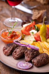 Canvas Print - cevapcici on a plate