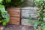 Fototapeta  - two wooden compost bin in family garden home