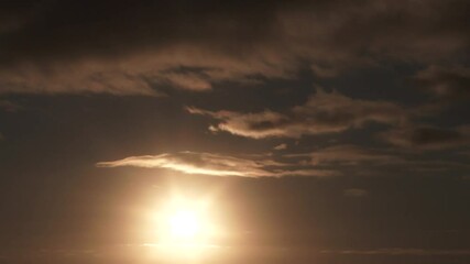 Wall Mural - Night To Day Sunrise Timelapse On Warm Cloudy Sky