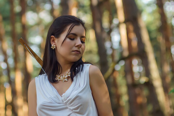 Wall Mural - portrait of a young beautiful woman in a white tunic with a gold belt in the image of the ancient Greek goddess Artemis