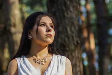 portrait of a young beautiful woman in a white tunic with a gold belt in the image of the ancient Greek goddess Artemis