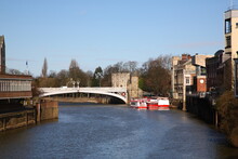 Scenic View Along The River Ouse With  Lendal Bridge And City Cruise Boats On The River During Early Spring In York,  Yorkshire, England, UK