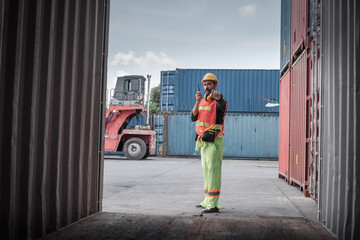 Wall Mural - Container Supervisor Control Import/Export While Inspecting Containers Box in Warehouse Storage Distribution. Container Logistics Shipping Controlling of Transportation Industry, Cargo Ship Factory