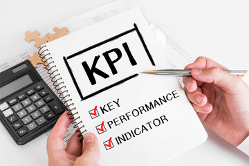 Poster - businessman writing kpi concepts on his note