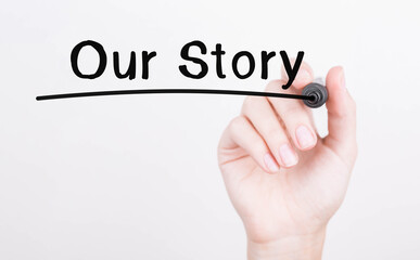Poster - Hand writing Our Story with black marker on transparent wipe board