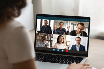 Wall Mural - close up view of woman talk on video call on laptop with diverse multiracial colleagues. female empl