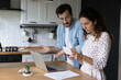 © fizkes - Unhappy young man and woman frustrated by mistake or error when paying bills on computer online. Stunned couple confused by debt calculating family household financial expenditures at home.