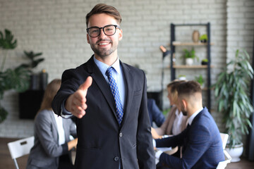 Poster - Businessman with an open hand ready to seal a deal.