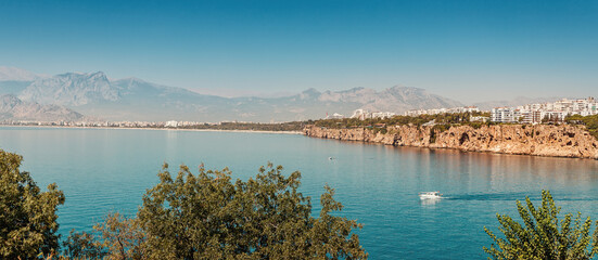 Wall Mural - Panoramic idyllic view of the sea coast in Antalya. Taurus mountains in the background and the blue Bay of the Mediterranean sea