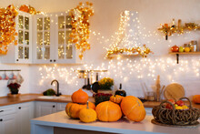 Autumn Kitchen Interior. Red And Yellow Leaves And Flowers In The Vase And Pumpkin On Light Background