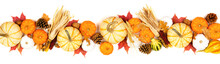 Autumn Border Of Assorted Pumpkins, Gourds, Leaves And Corn. Top View Isolated On A White Background.