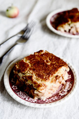 Wall Mural - Apple and Cheese Cobbler Crisp. Cobbler or Crumble dessert with apples on plates on beige linen table. Selective focus