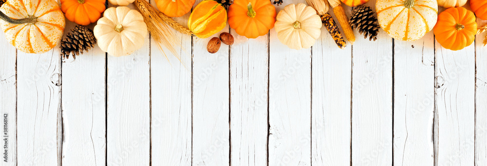 Autumn top border of pumpkins and fall decor. Overhead view on a rustic ...