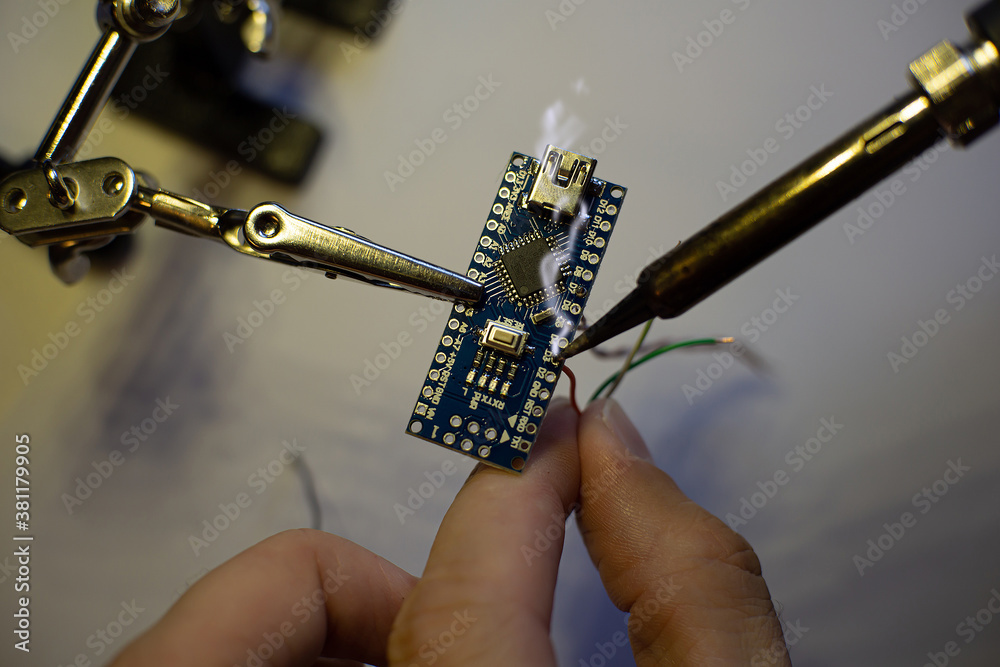 Arduino Microcontroller Solderable The process of soldering wires to an arduino nano board. The clamp ...