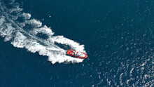 Aerial Drone Photo Of Red Pilot Boat Cruising In High Speed In Mediterranean Deep Blue Sea Offering Navigational Aid To Ships