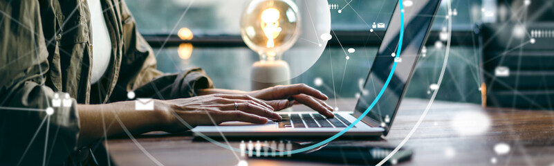 Female hands with laptop. Young woman working remotely at home. Concept of networking or remote work. Global business network. Online courses.