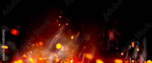 Fotografía Flame with sparks and smoke isolated on black background