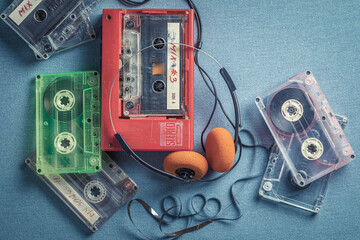 Vintage cassette tape with headphones and player