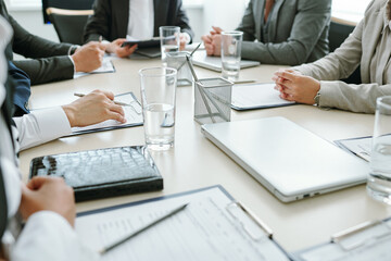 Poster - Hands of contemporary business partners over documents in clipboards