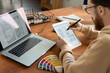 © pressmaster - Young male freelance software developer holding stylus over tablet screen
