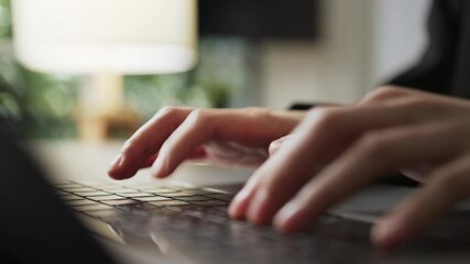 Wall Mural - Close up of hand typing on the computer keyboard, on wooden desk.