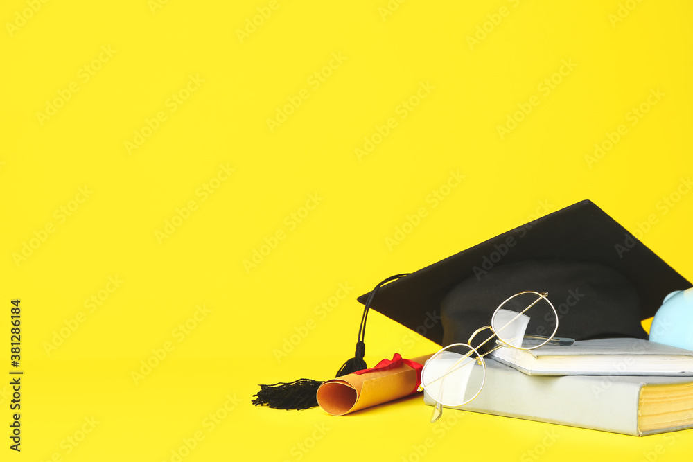 Graduation hat, diploma, eyeglasses and books on color background