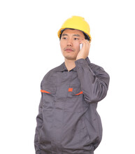 Migrant Worker Wearing Yellow Hard Hat In Front Of White Background Is Calling Home