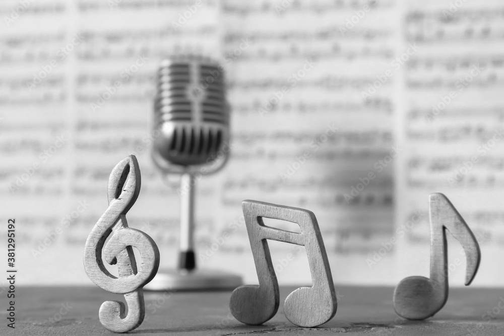 Music notes on table, closeup view