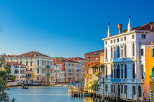 Venice Cityscape With Grand Canal Waterway. Vaporettos, Yachts And Boats Sailing Canal Grande. Palazzo Giustinian Lolin And Ca Rezzonico Baroque Style Palace. Veneto Region, Northern Italy