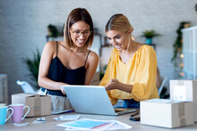 Two Beautiful Freelance Business Women Seller Checking Product Order With Computer In Their Startup Small Business.
