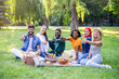 © Evgeniia - Best friends are on picnic in the park.