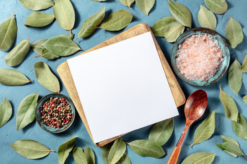 Wall Mural - Recipe design template, paper in the kitchen with salt, pepper, and bay leaves, a culinary flat lay