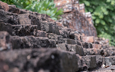 Wall Mural - Close-up of Cracked concrete vintage brick wall background. Archaeological area. Pattern on the wall with space for text, Focus and blur.